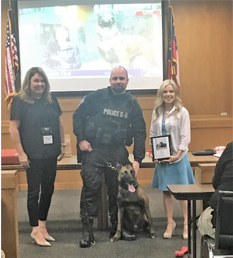 Officer Norman Larsen, K-9 Indi receive the Award of Bravery from the Animal Law Source