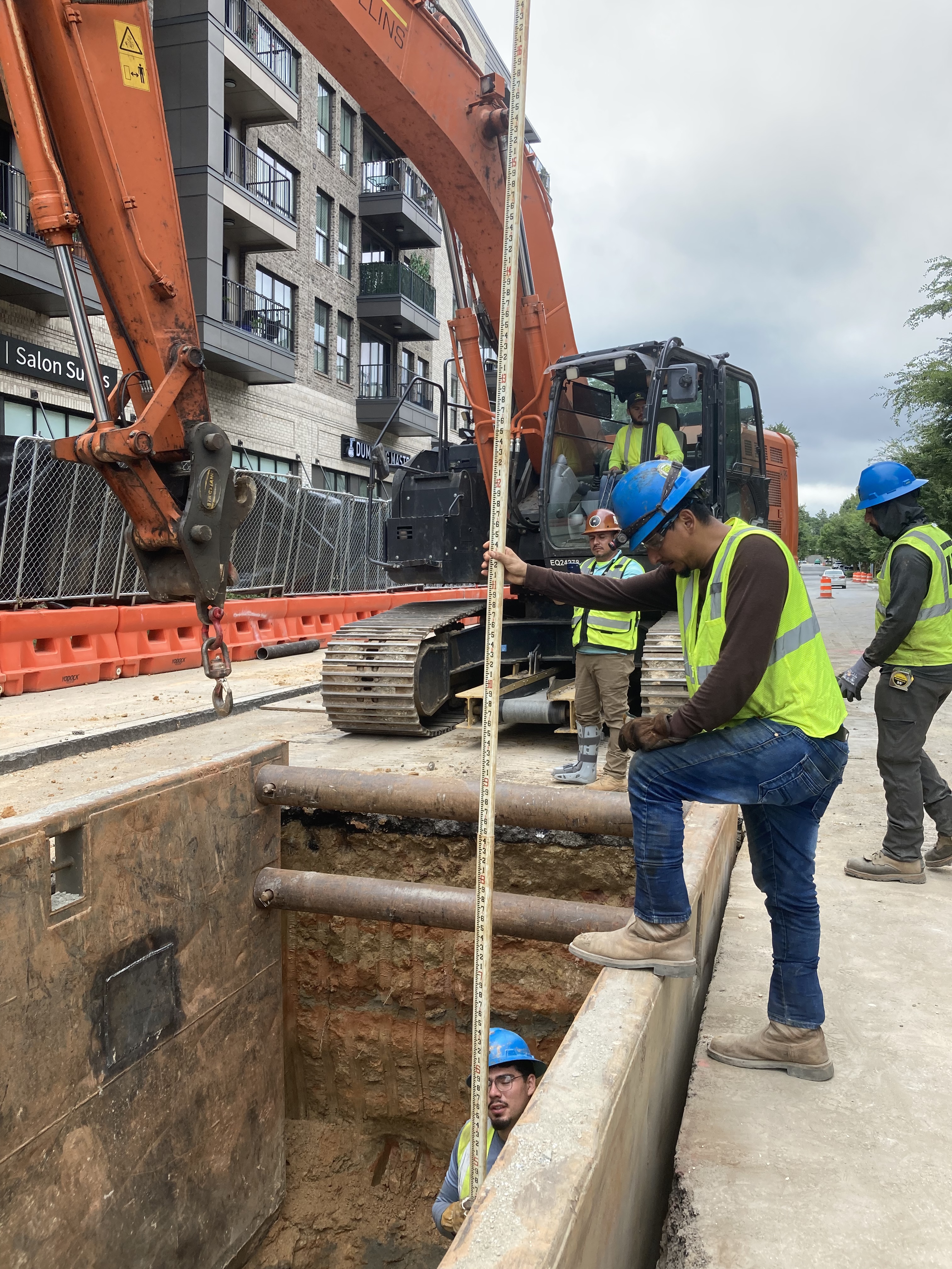 Photo of crews installing pipe on Malone Drive