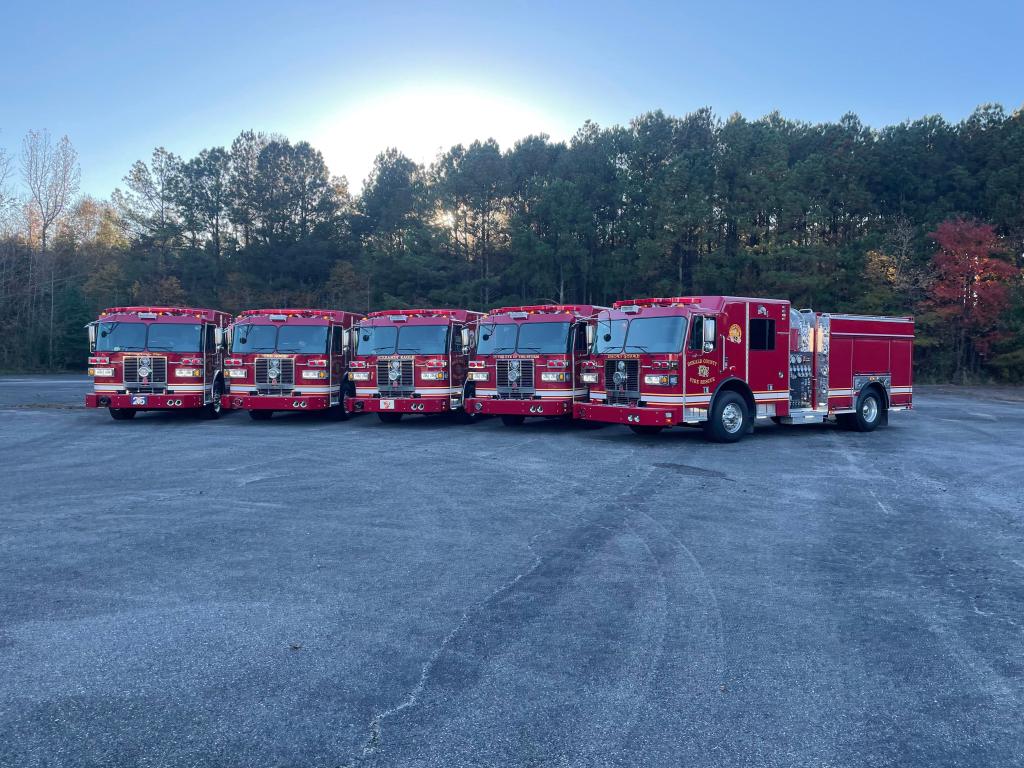 Five fire pumper trucks